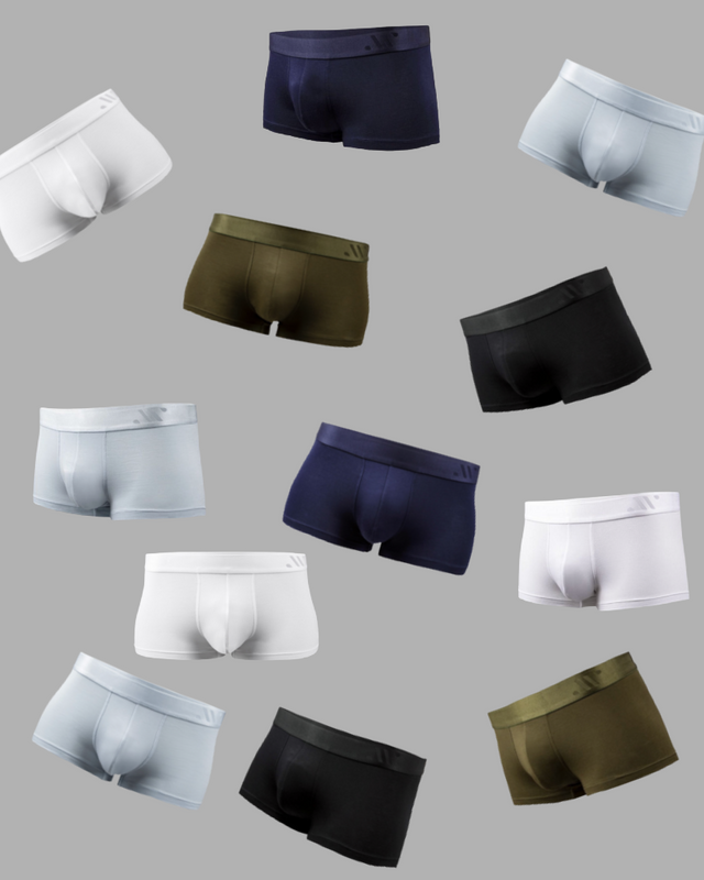 Trunks on tabletop in frost white, glacier blue, midnight black, moss green, maritime navy
